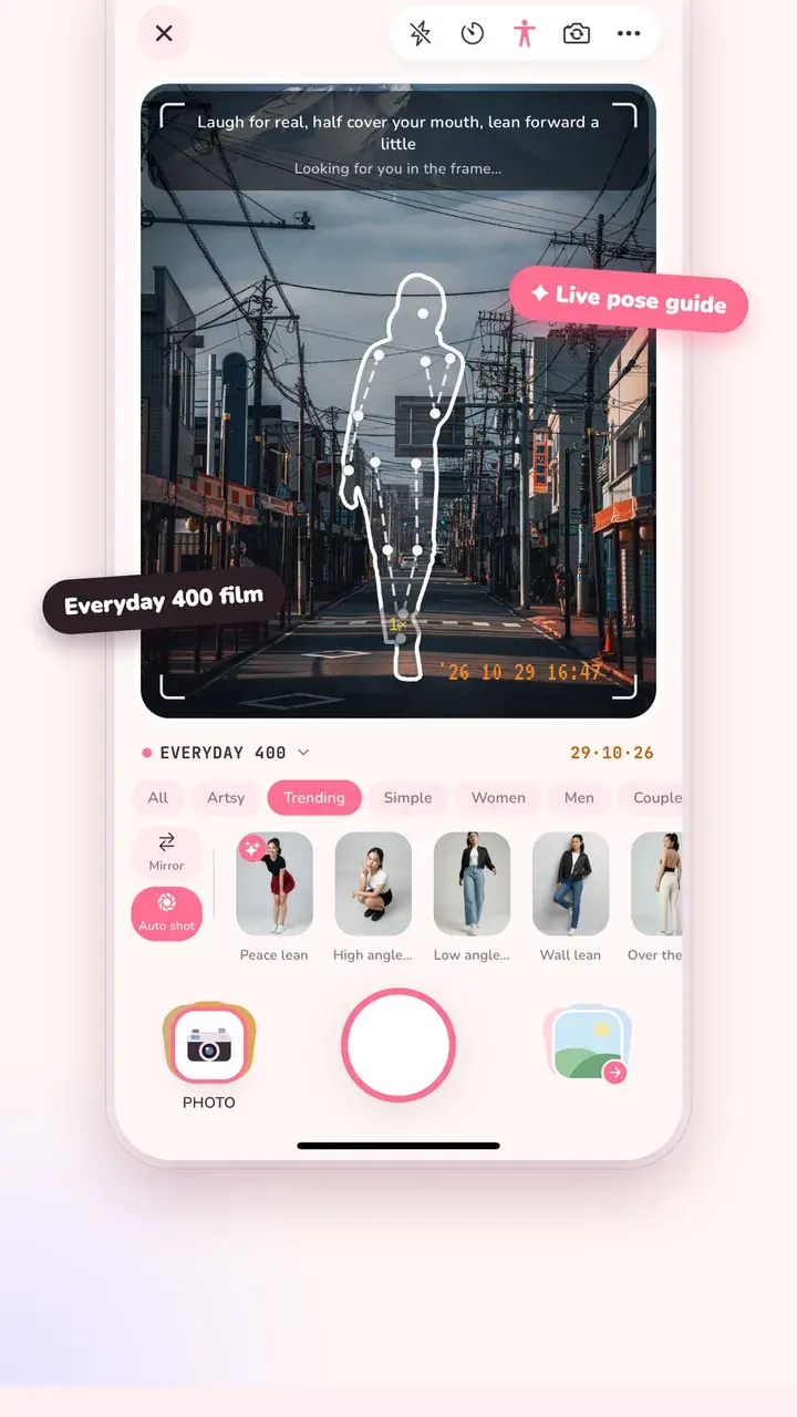 Tint Cam camera with a pose outline on the viewfinder and a row of poses to choose from