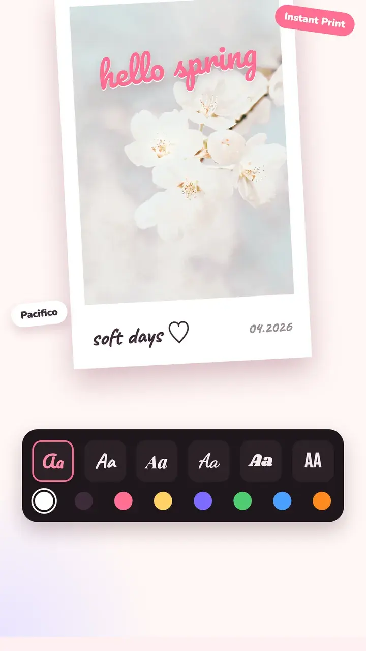 A spring blossom photo in an instant print frame with “hello spring” and “soft days” written on it